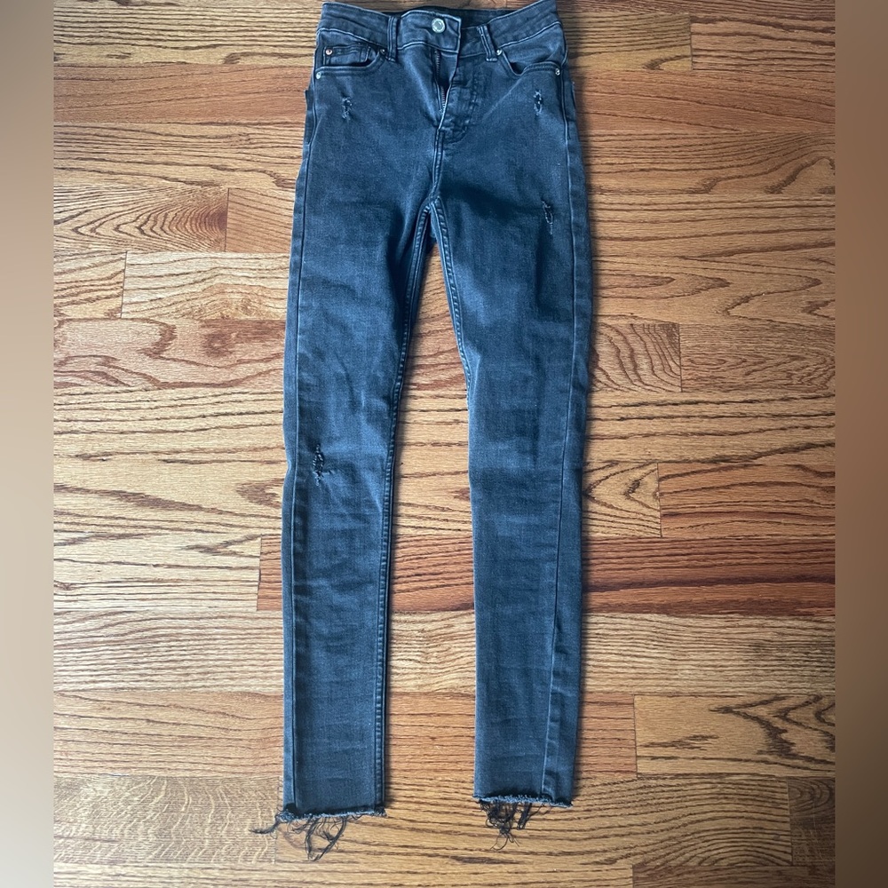 black slightly ripped skinny jeans